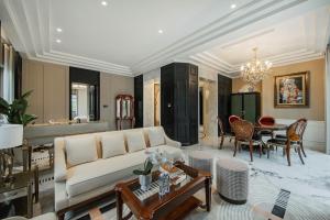 a living room with a couch and a table at Chongqing Manque Mansion, Century Old Republic Style & River View, Free Custom Photoshoot, Free Breakfast & 131 Skydeck Ticket in Chongqing