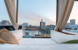 a large window with a view of a city at Sea & Sky 2 Bed Escape Apt in Santa Monica with FREE PARKING in Los Angeles