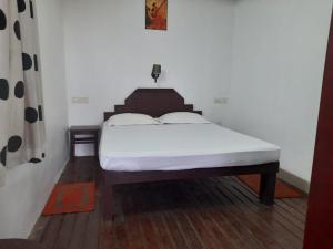 Postel nebo postele na pokoji v ubytování White Saand Beach Residence + 9 fotografií