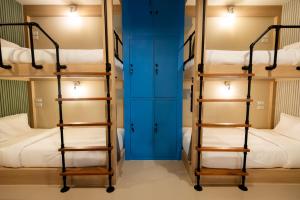Ένα ή περισσότερα κρεβάτια σε δωμάτιο στο Kewalin hostel