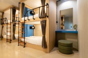 Ένα ή περισσότερα κρεβάτια σε δωμάτιο στο Kewalin hostel