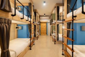 Ένα ή περισσότερα κρεβάτια σε δωμάτιο στο Kewalin hostel