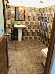 a bathroom with a sink and a shower at Haven house with AC in Kamburugamuwa