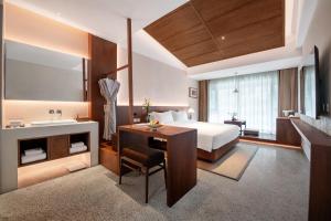 Krevet ili kreveti u jedinici u okviru objekta Chengdu Guiyuan Hotel