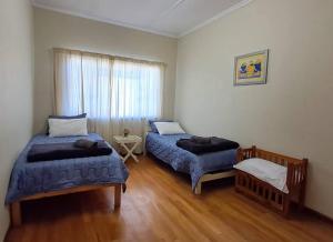 Postel nebo postele na pokoji v ubytování 3 Pauw Street - 8 guests