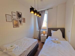 Postel nebo postele na pokoji v ubytování Große 3-Zimmer Wohnung - zentral-Coburg - kostenloser Parkplatz