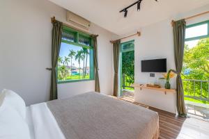 TV a/nebo společenská místnost v ubytování Manling Retreat Hoi An