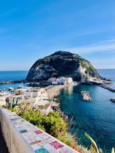 a view of a small island in the ocean at Casa Maadry in Ischia