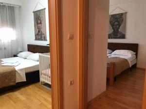 Postel nebo postele na pokoji v ubytování First Choice Apartment + 10 fotografií