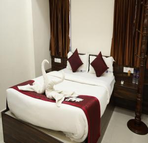 Letto o letti in una camera di Manopriya Residency by Azalea