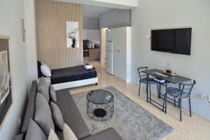 a living room with a couch and a table at Villa Constangie in Marathon