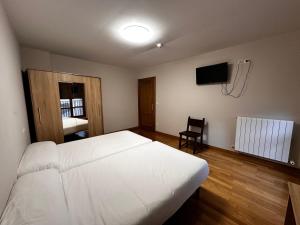 Posteľ alebo postele v izbe v ubytovaní Hostal Rural 18 de Abril