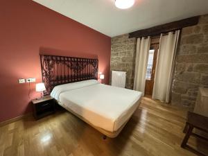 Posteľ alebo postele v izbe v ubytovaní Hostal Rural 18 de Abril