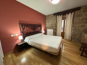 Posteľ alebo postele v izbe v ubytovaní Hostal Rural 18 de Abril