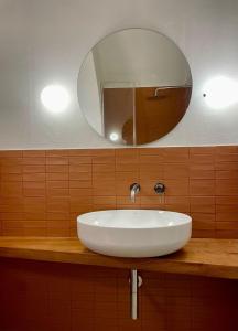a white sink in a bathroom with a mirror at B&B La Casa Di Bianca in Manfredonia +60 photos