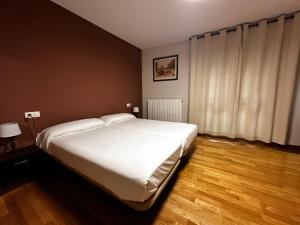 Posteľ alebo postele v izbe v ubytovaní Hostal Rural 18 de Abril