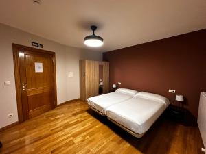 Posteľ alebo postele v izbe v ubytovaní Hostal Rural 18 de Abril