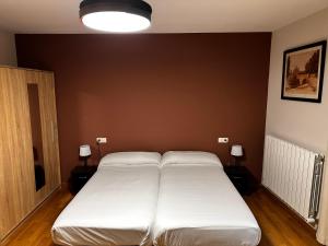 Posteľ alebo postele v izbe v ubytovaní Hostal Rural 18 de Abril