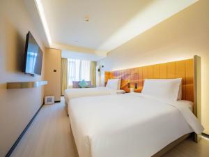 Katil atau katil-katil dalam bilik di 西安北站市政府漫心酒店