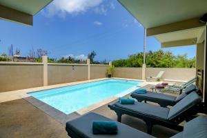 Πισίνα στο ή κοντά στο Villa Les Cocotiers by Oceanaxe Holidays