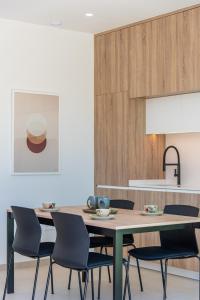 a dining room with a table and chairs at Villa Buba in Pilar de la Horadada