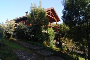 a house on a hill with trees in front of it at Cabana de Santo António in Vila Nova de Cerveira
