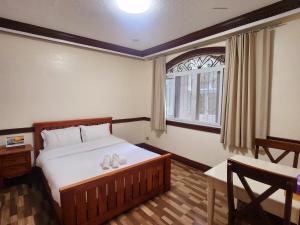 Postel nebo postele na pokoji v ubytování Villa Moa Baguio
