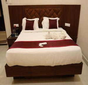 Letto o letti in una camera di Manopriya Residency by Azalea