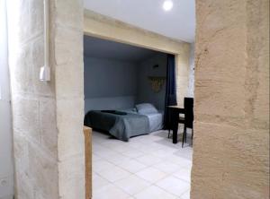 Ένα ή περισσότερα κρεβάτια σε δωμάτιο στο Appartement - Parking - Wifi - 1 à 6 pers -