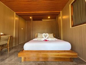 Postel nebo postele na pokoji v ubytování Ringsun Homestay Uluwatu