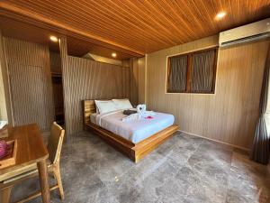 Postel nebo postele na pokoji v ubytování Ringsun Homestay Uluwatu