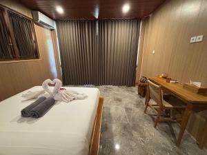 Postel nebo postele na pokoji v ubytování Ringsun Homestay Uluwatu