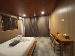 Postel nebo postele na pokoji v ubytování Ringsun Homestay Uluwatu