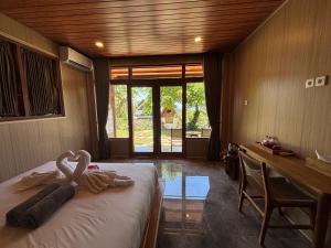 Postel nebo postele na pokoji v ubytování Ringsun Homestay Uluwatu