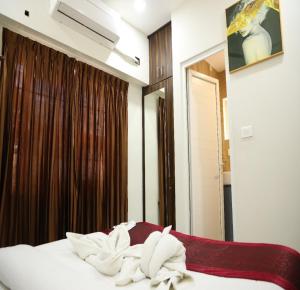 Letto o letti in una camera di Manopriya Residency by Azalea