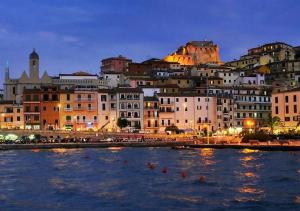 a view of a city at night at Blu Celeste in Porto Santo Stefano