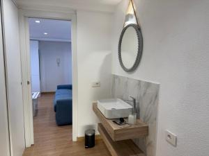 a bathroom with a sink and a mirror on the wall at Blu Celeste in Porto Santo Stefano +12 photos