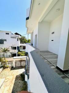 a view of a balcony of a building at Garden Beach Hotel in Arugam Bay
