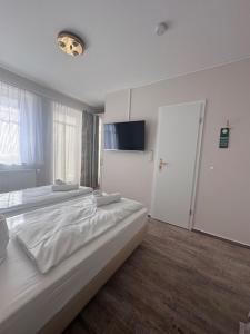 Postel nebo postele na pokoji v ubytování Hotel Villa Weststrand