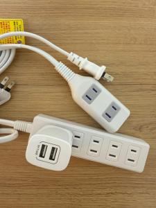 a white electronic device sitting on top of a table at Camelot House in Fukuoka