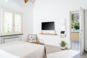 Ένα ή περισσότερα κρεβάτια σε δωμάτιο στο Villa Fiore