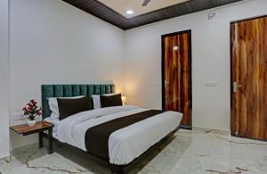 Postel nebo postele na pokoji v ubytování Hotel O Kashish Residency + 23 fotografií