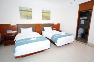 Huizhou Hazens East Bay Resort客房内的一张或多张床位