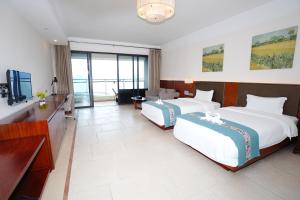 Huizhou Hazens East Bay Resort的电视和/或娱乐中心