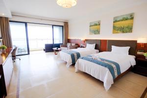 Huizhou Hazens East Bay Resort客房内的一张或多张床位