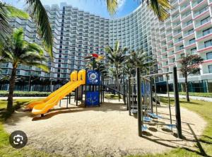 a playground in front of a large building at The Cam Ranh Near The Airport in Cam Ranh International Airport
