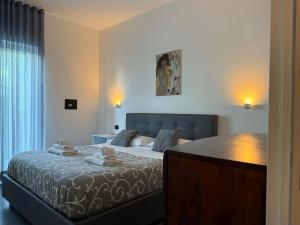 a bedroom with a bed in a room at Light stadium in Taormina