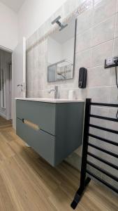 a bathroom with a sink and a mirror at Terry's house in Ciampino