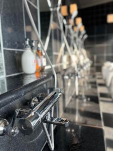 a kitchen counter with a sink with aaucet at Chateraise Hotel Nagano in Nagano