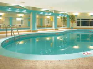 a large swimming pool in a hotel room at Riviera Hotel in Torquay